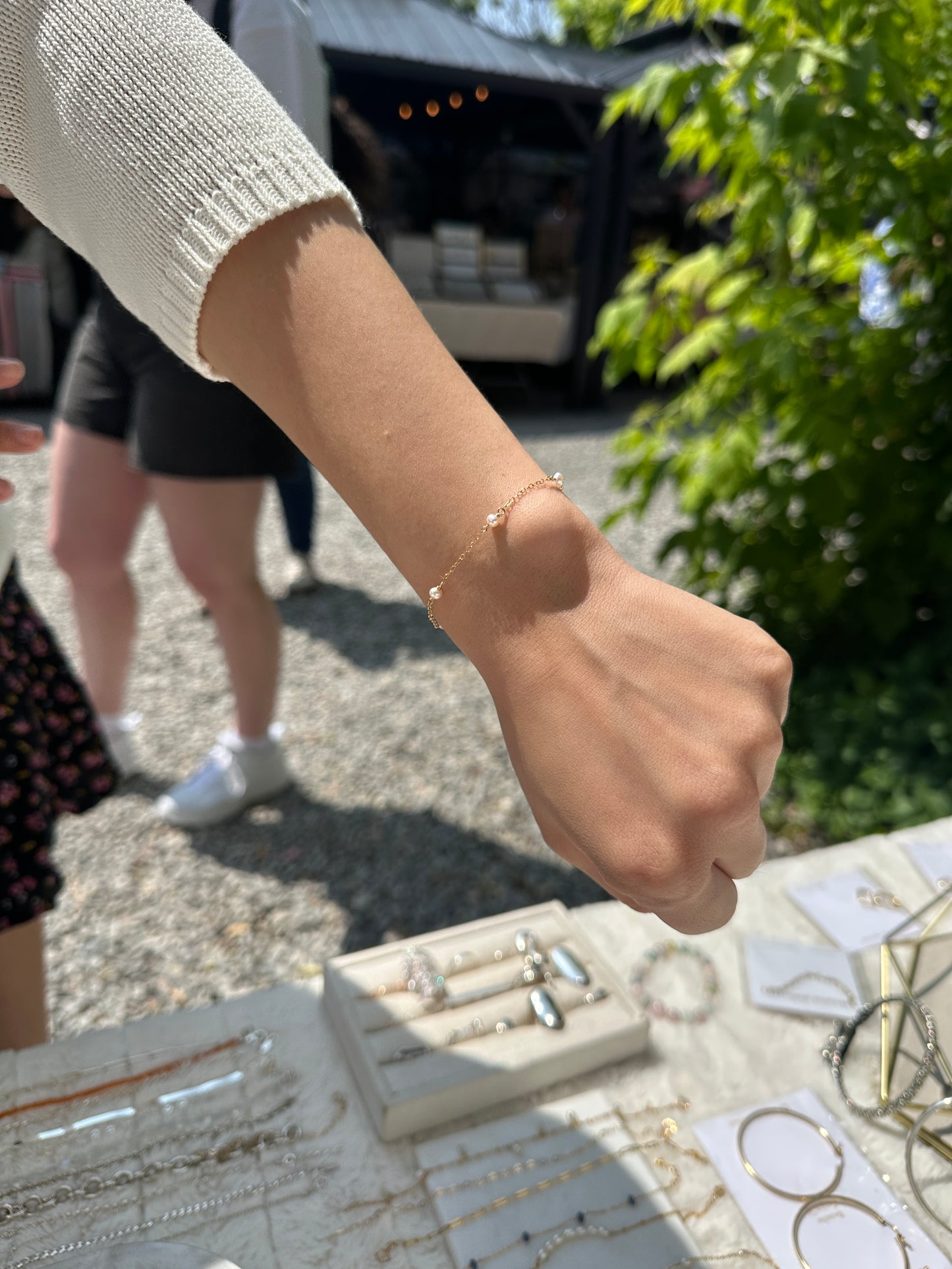 Person wearing a bracelet with a scenic background