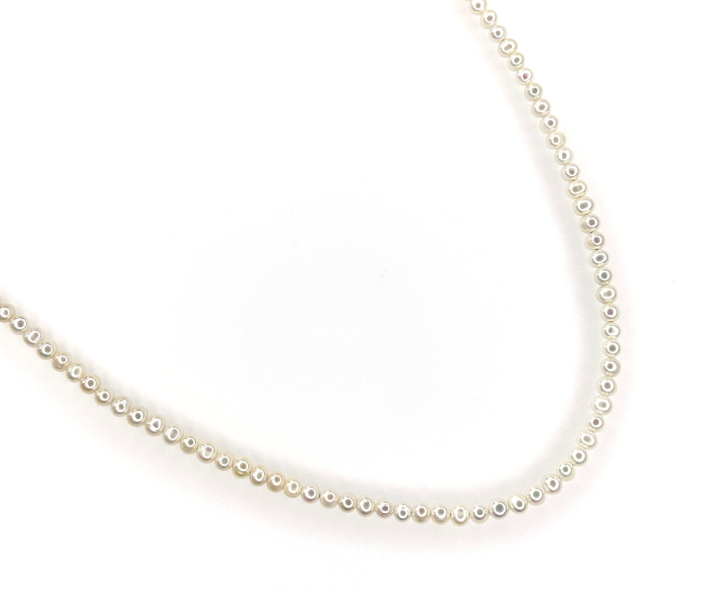 A close-up image of a freshwater pearl necklace with a focus on the luster and shine of the pearls.