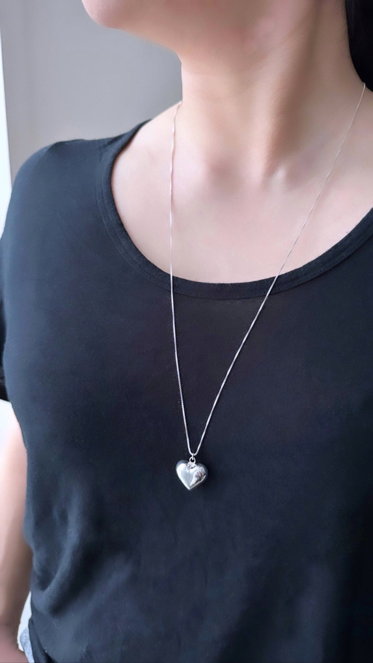 sterling silver big puffy heart necklace on model