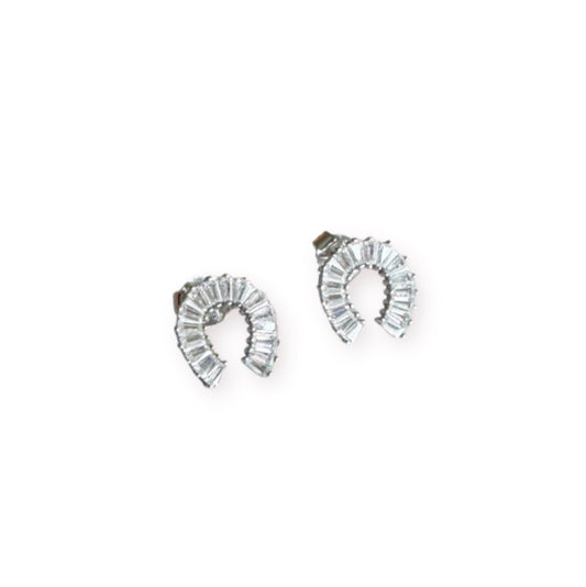Pair of silver hoop earrings with clear gemstones on a white background