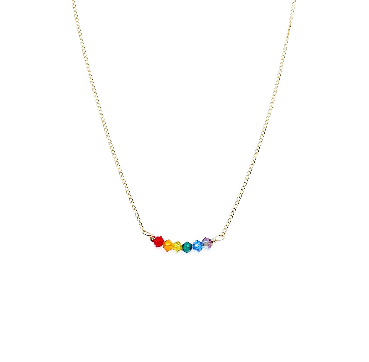 Close-up of rainbow pride necklace with six Swarovski crystal beads on 14K gold-filled chain
