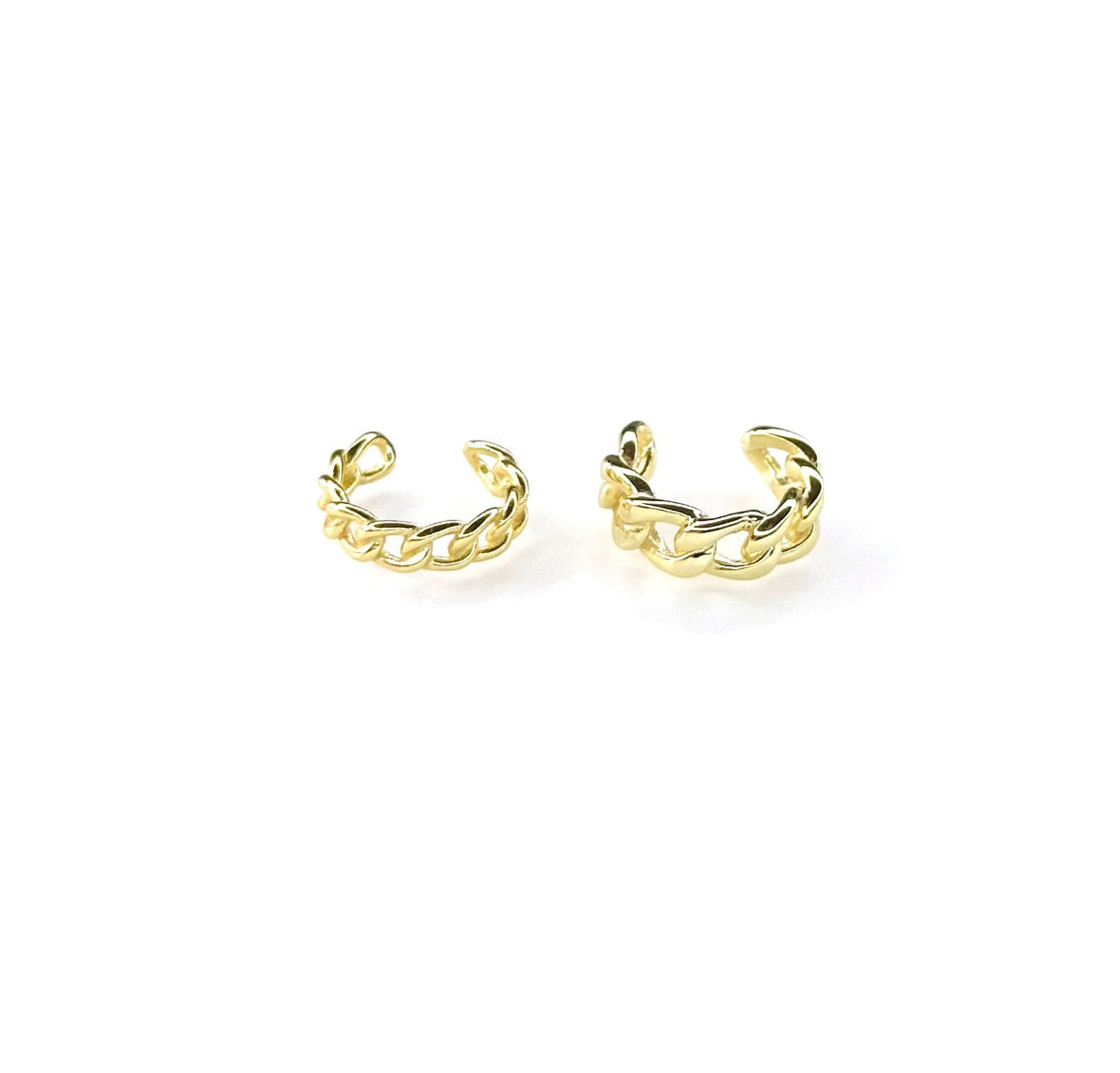 A pair of gold-plated sterling silver orbital ear cuffs with a swirl design, displayed against a white background.