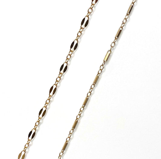 Two gold-filled chains, one a twin chain and the other a gold bar chain, against a white background.