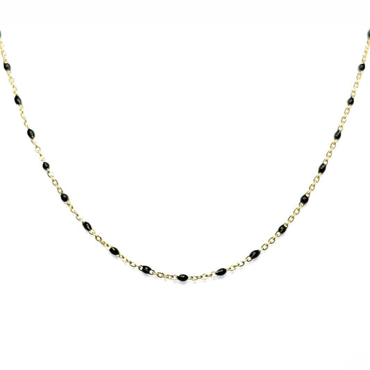 A gold-filled satellite chain necklace with black enamel accents.