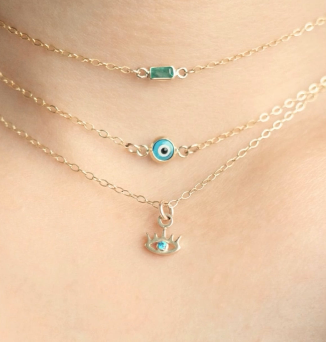 Teeny lashed evil eye necklace with solid gold pendant charm
