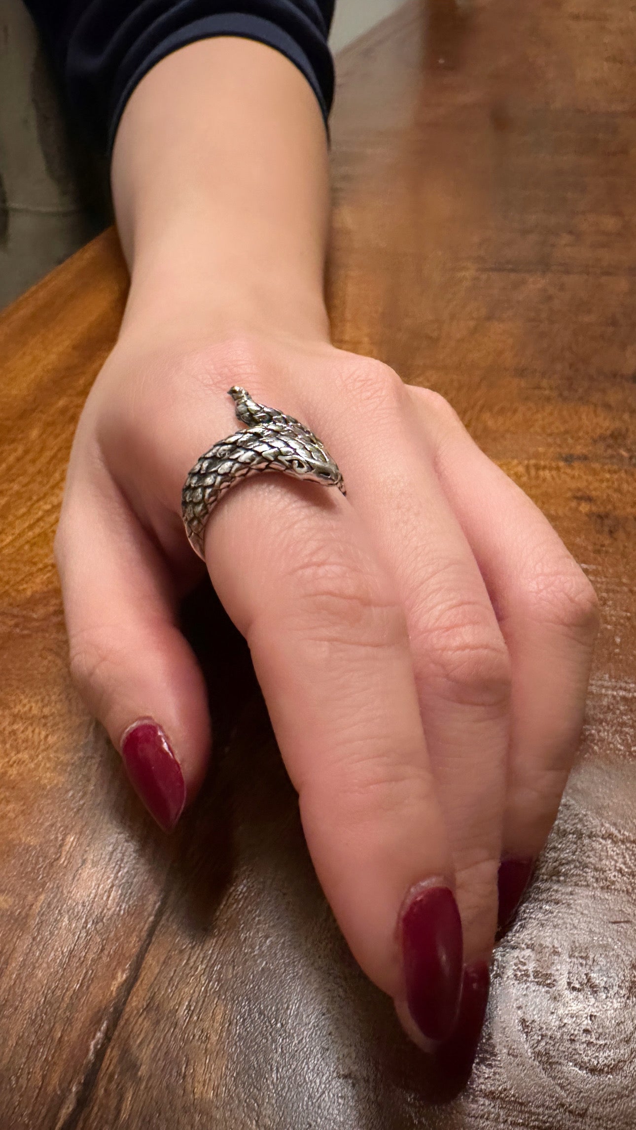 Sterling silver snake ring on hand