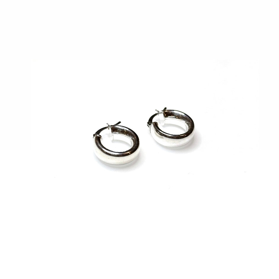 Close up of sterling silver chunky hoop earrings in petite size - shower safe everyday jewellery

