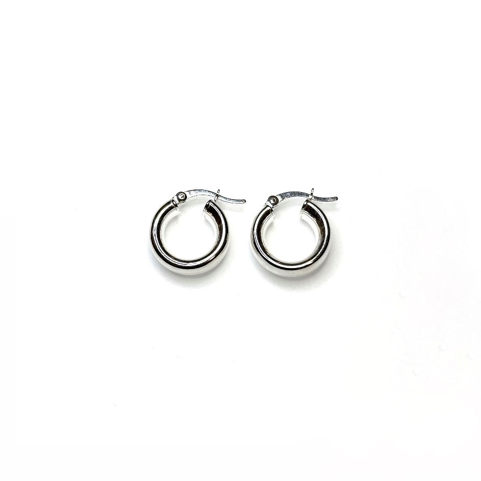 A pair of petite chunky hoop earrings made of sterling silver, displayed against a white background.