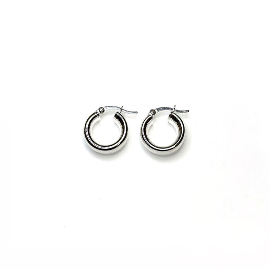 A pair of petite chunky hoop earrings made of sterling silver, displayed against a white background.