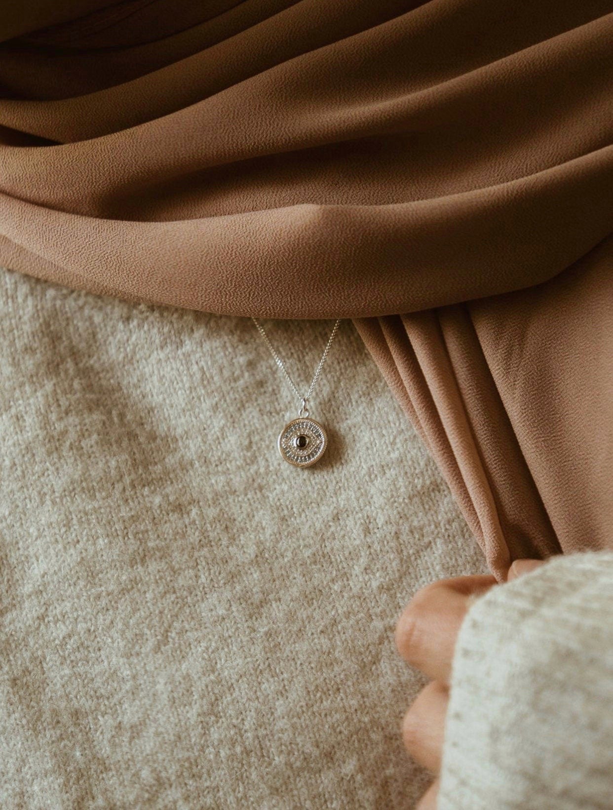 sterling silver evil eye medallion necklace on model