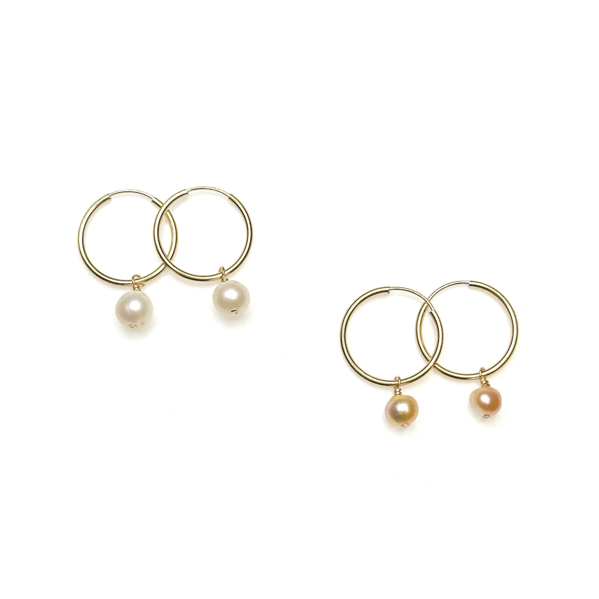 white pearl and pink pearl minimalist gold filled pearl earrings side by side