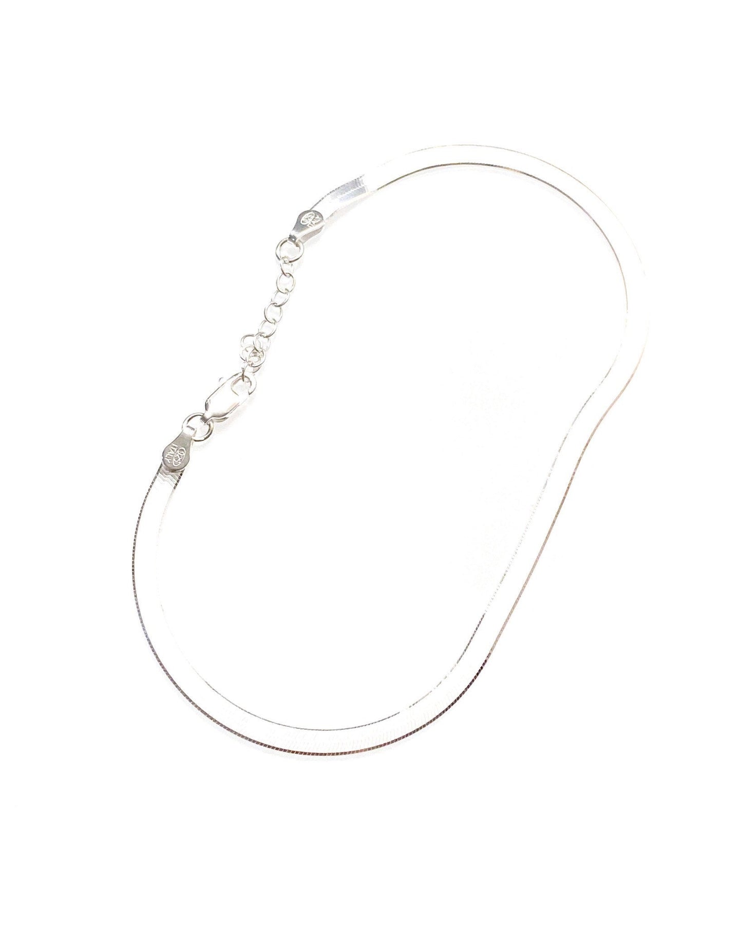 Herringbone anklet styled and worn showing adjustable fit and elegant design
