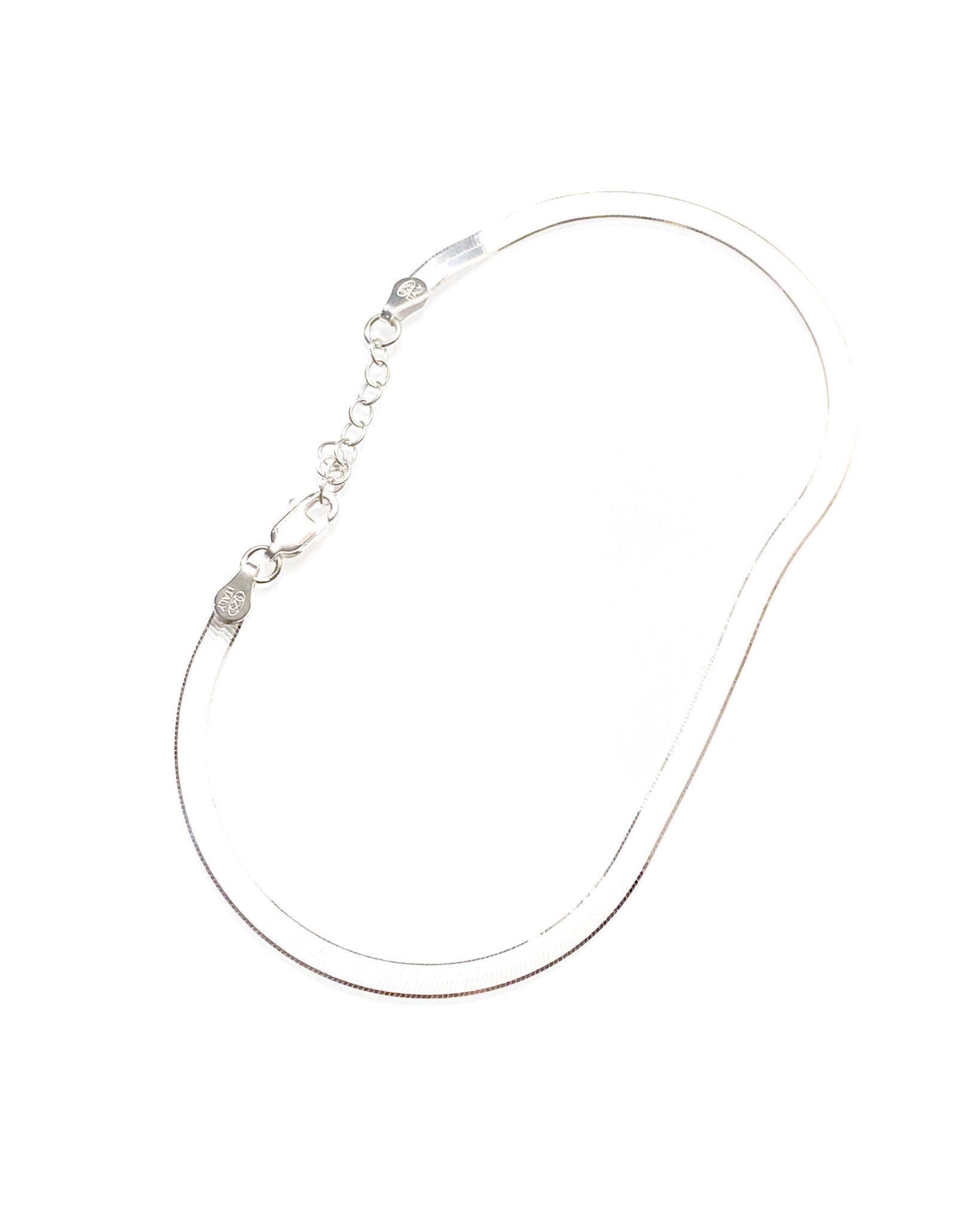 Herringbone anklet styled and worn showing adjustable fit and elegant design