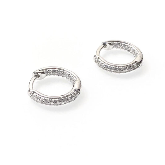 Endless sparkle CZ huggie earrings in sterling silver with cubic zirconia stones, available in 14mm and 20mm sizes
