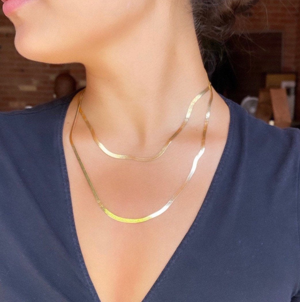 Gold herringbone chain necklaces layered together showing 16" and 20" lengths for statement look