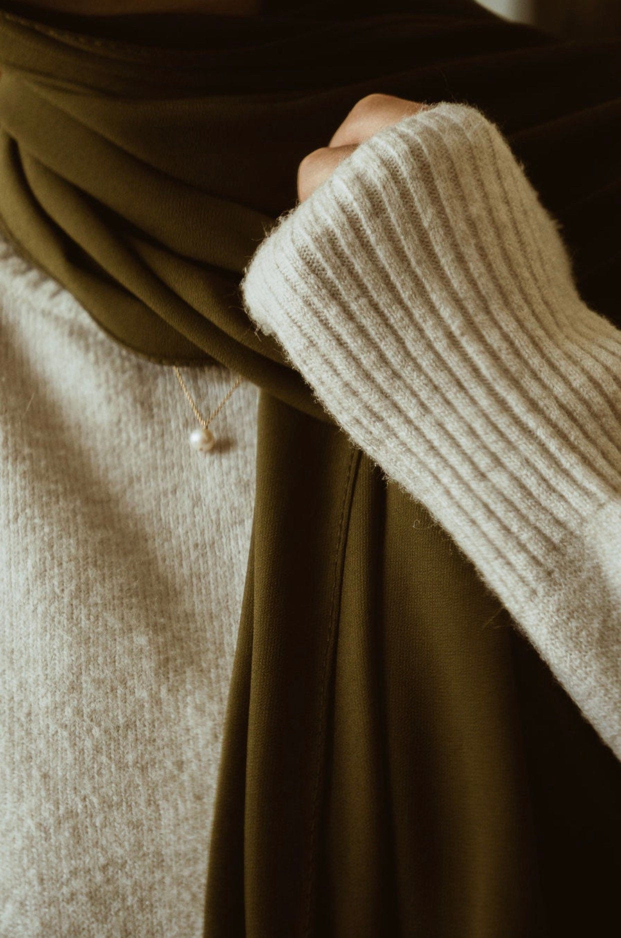 Close-up of minimalist freshwater pearl necklace showing natural pearl lustre and unique characteristics