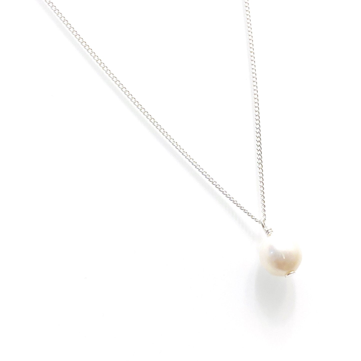 Minimalist freshwater pearl necklace styled and worn, perfect for bridal or everyday elegance