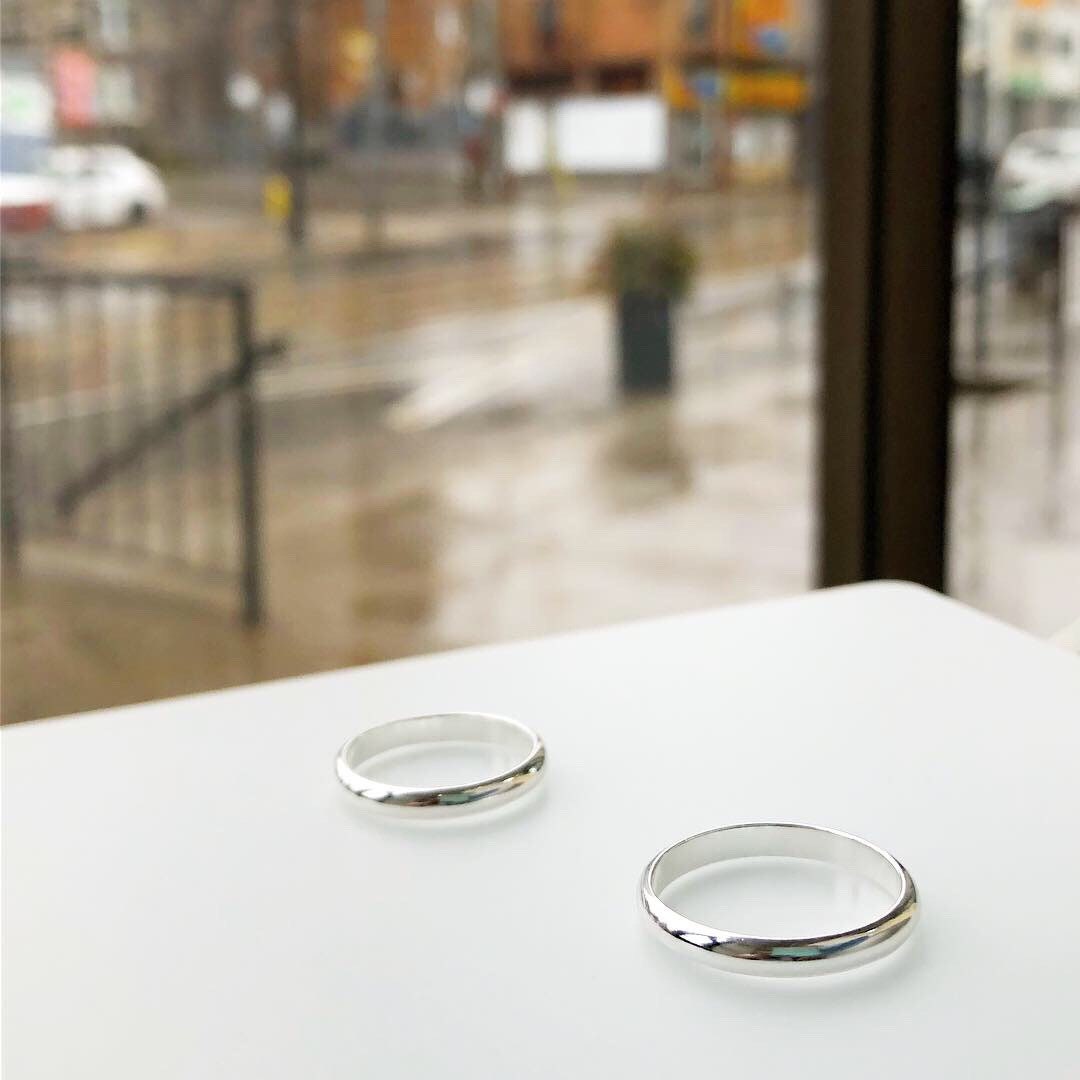 Side profile of sterling silver band ring showing width and comfortable fit