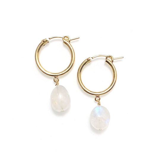A pair of gold-filled hoop earrings with rainbow moonstone gemstone drops, displayed against a white background.