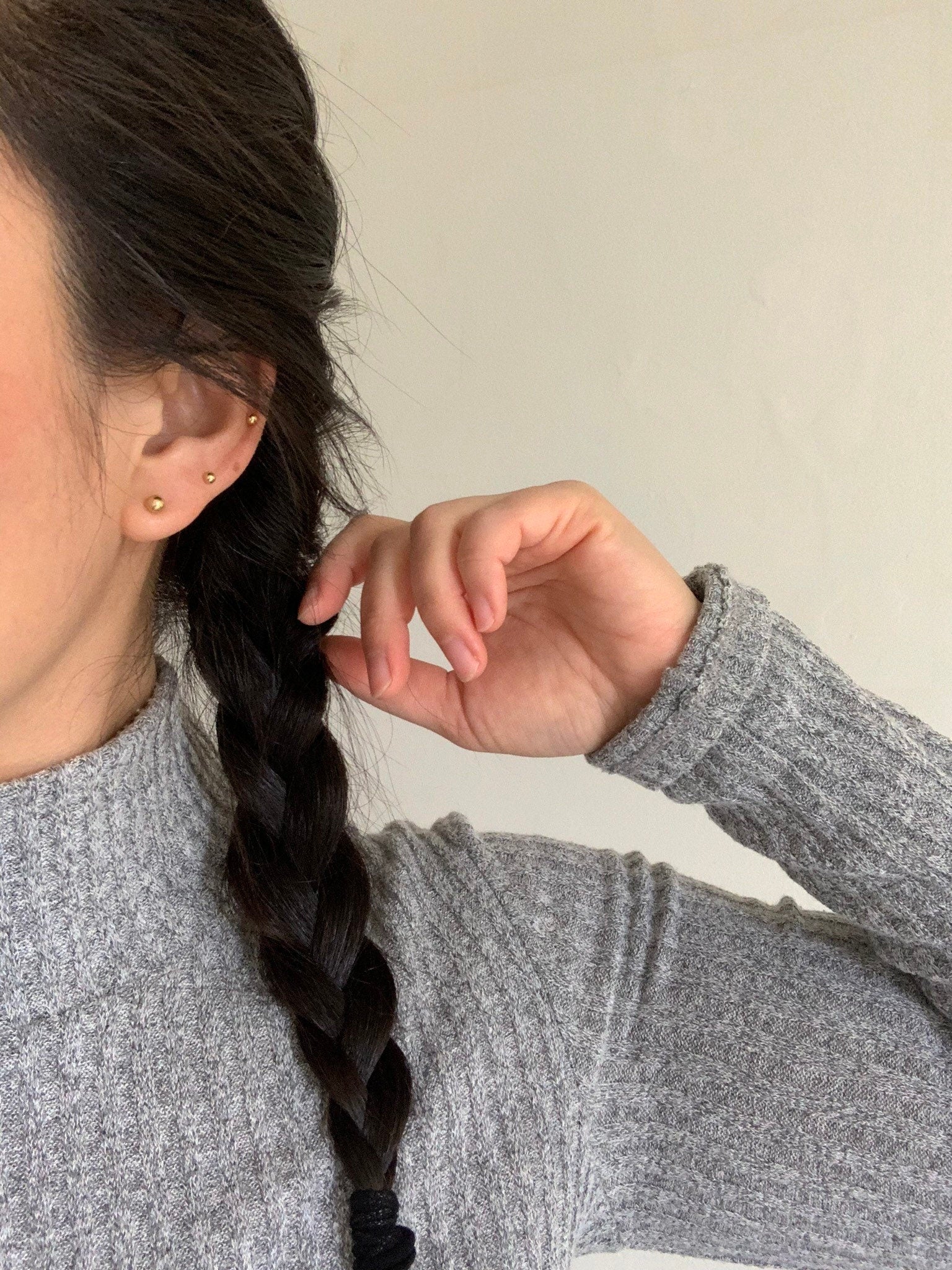 gold filled ball studs on ear worn by model