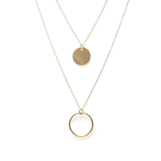 A gold filled disc necklace with a perfect circle necklace layered below.