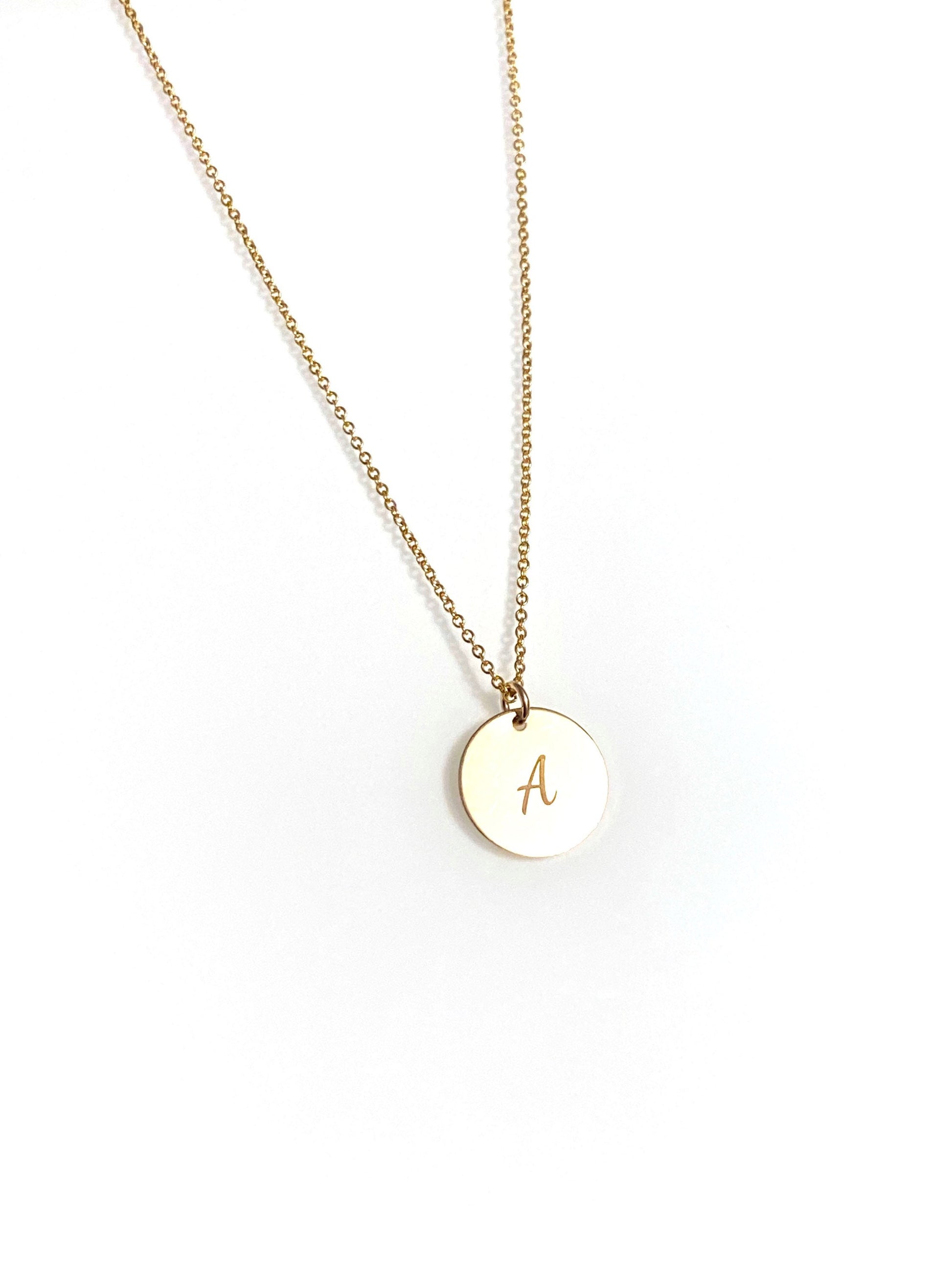 gold filled disc necklace with A engraved on surface