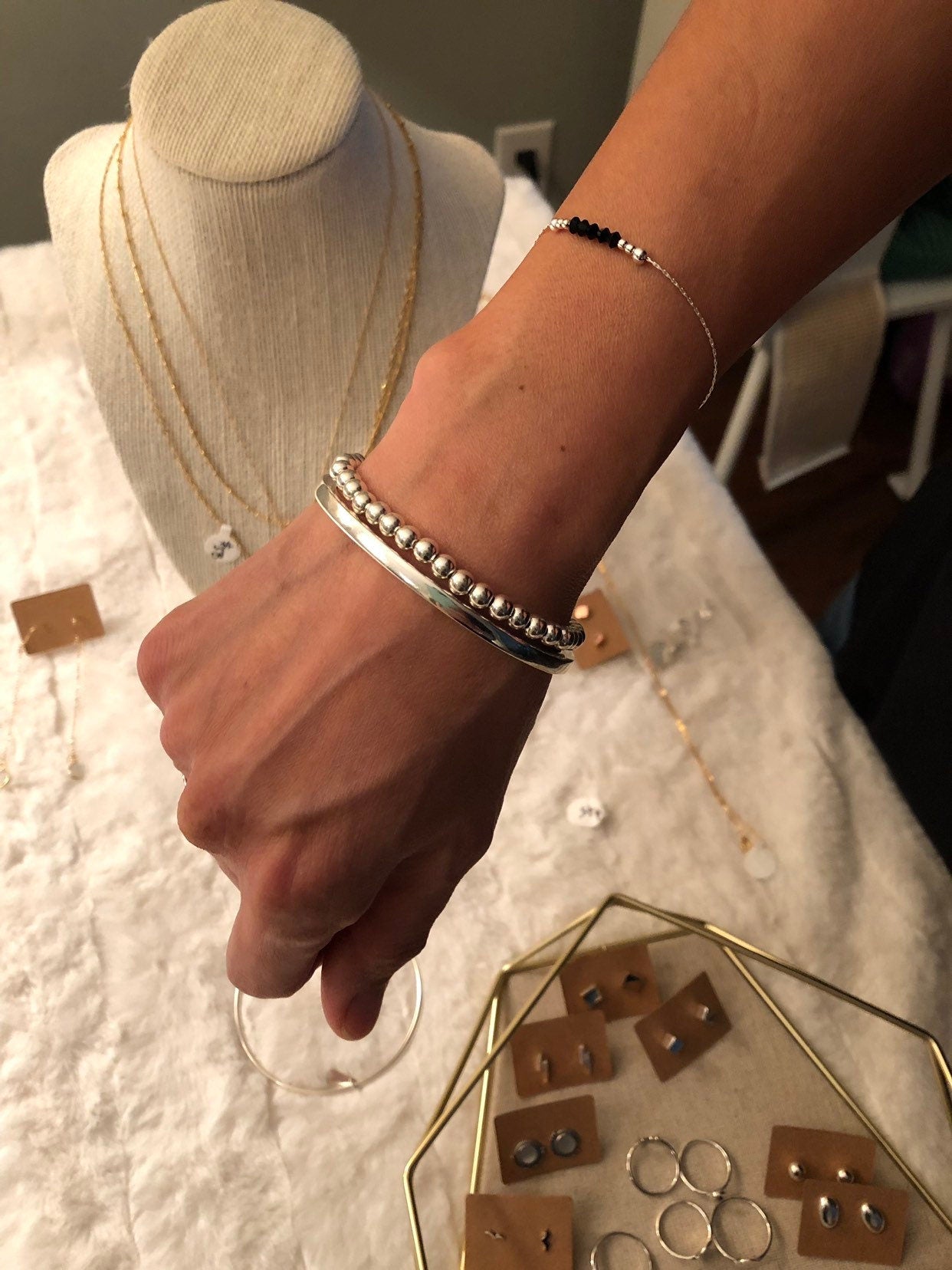 large sterling silver ball bracelet on wrist