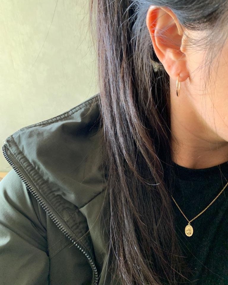 petite st christopher medallion on and everyday hoop on model