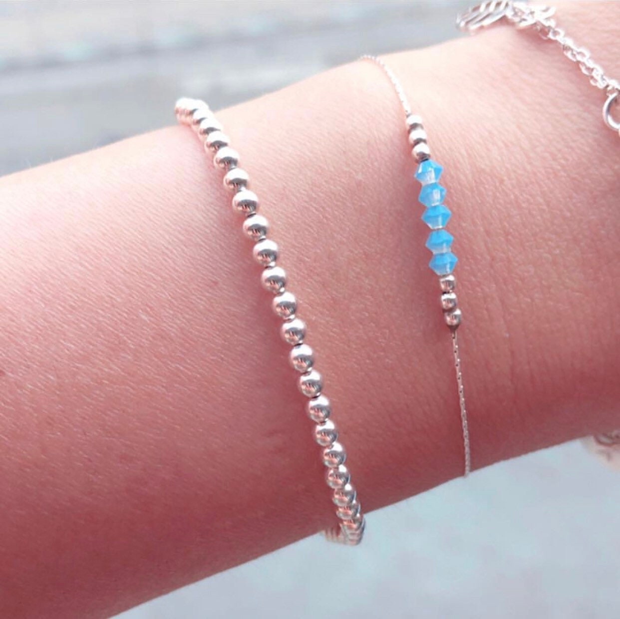 small ball bracelet in sterling silver on wrist