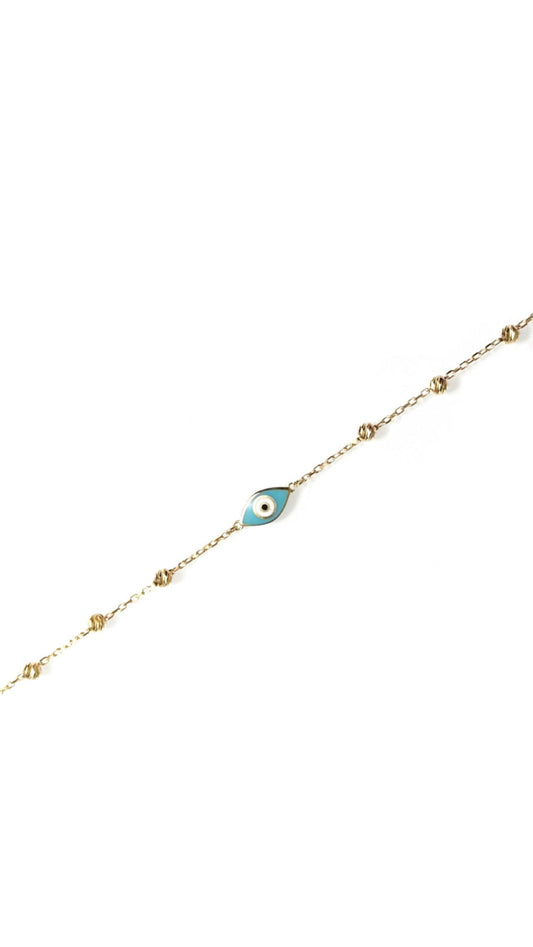 sparkly evil eye bracelet in solid gold against white background