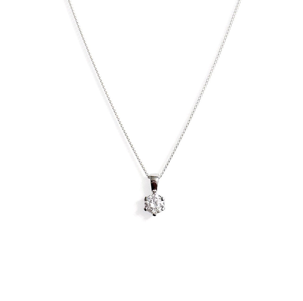 A sterling silver necklace with a central cubic zirconia solitaire pendant, available in three different lengths.
