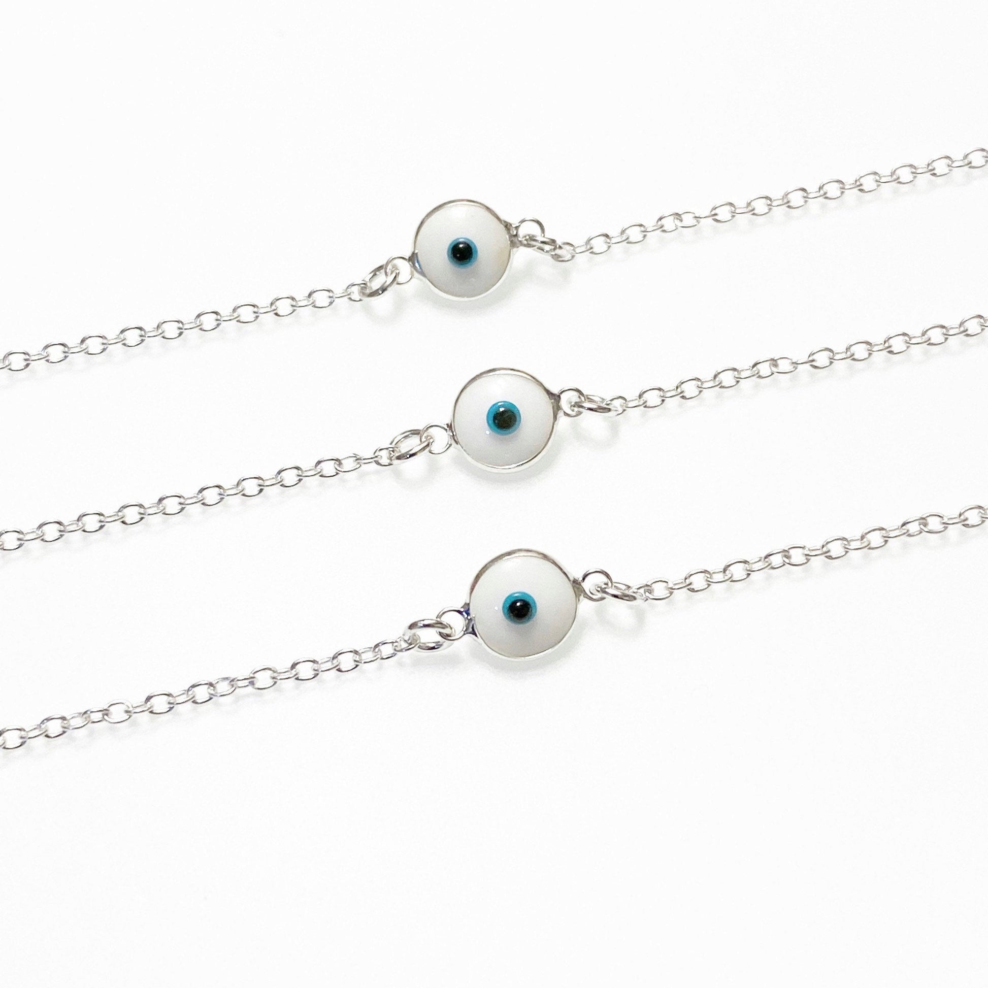 sterling silver bff evil eye braclets side by side