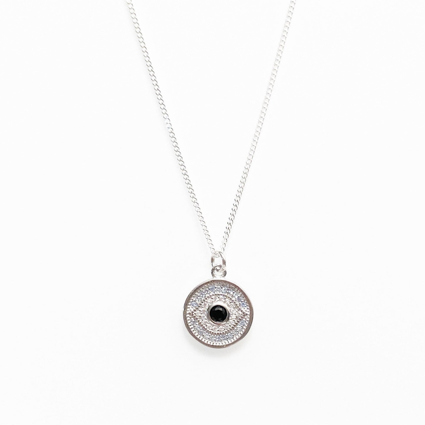 sterling silver evil eye medallion close up