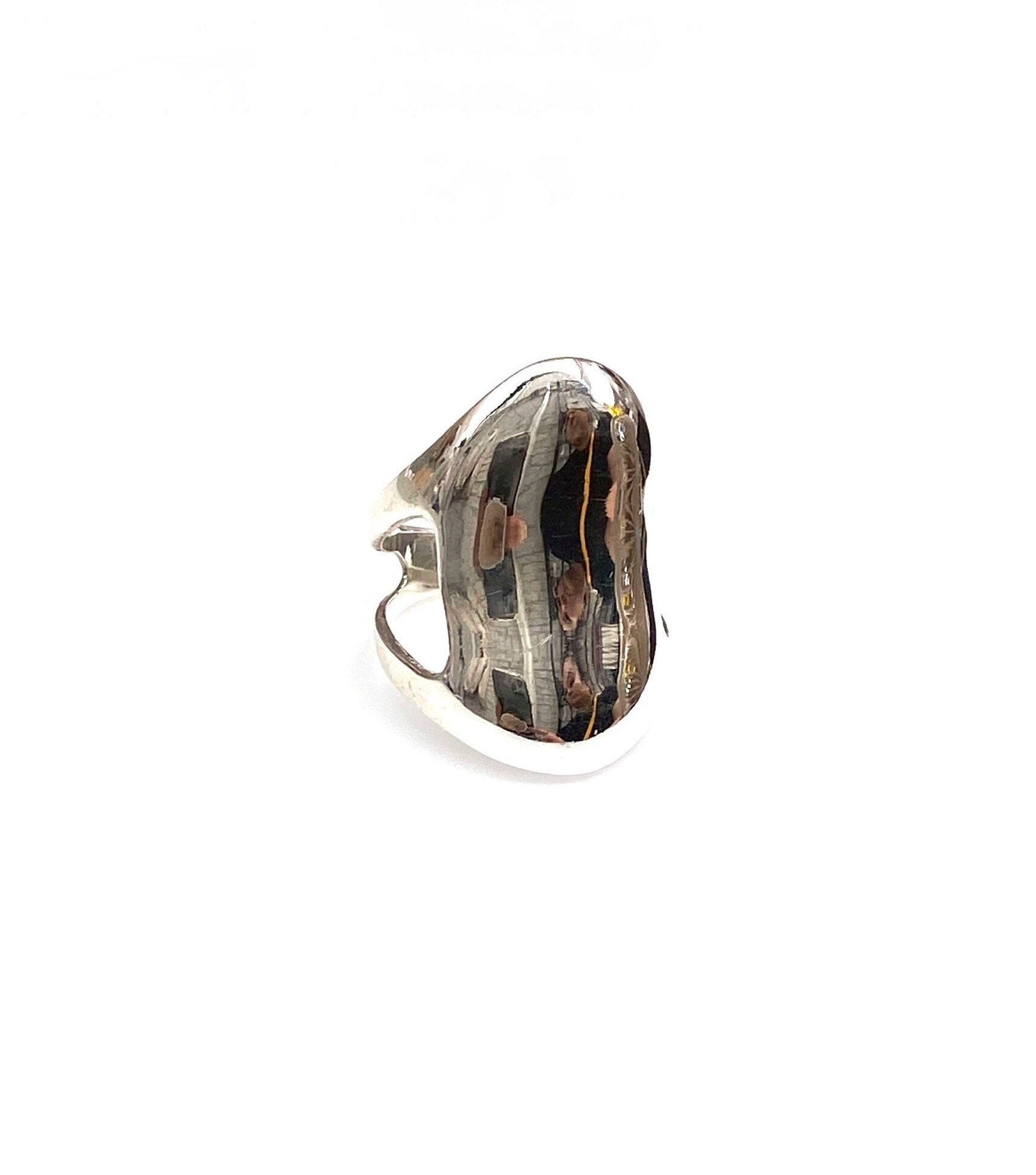 sterling silver liquid shield ring with reflection on surface
